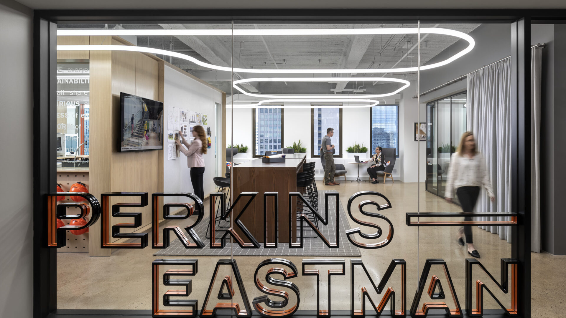 The entrance to Perkins Eastman's Pittsburgh studio features bold and playful signage and bright, welcoming space.