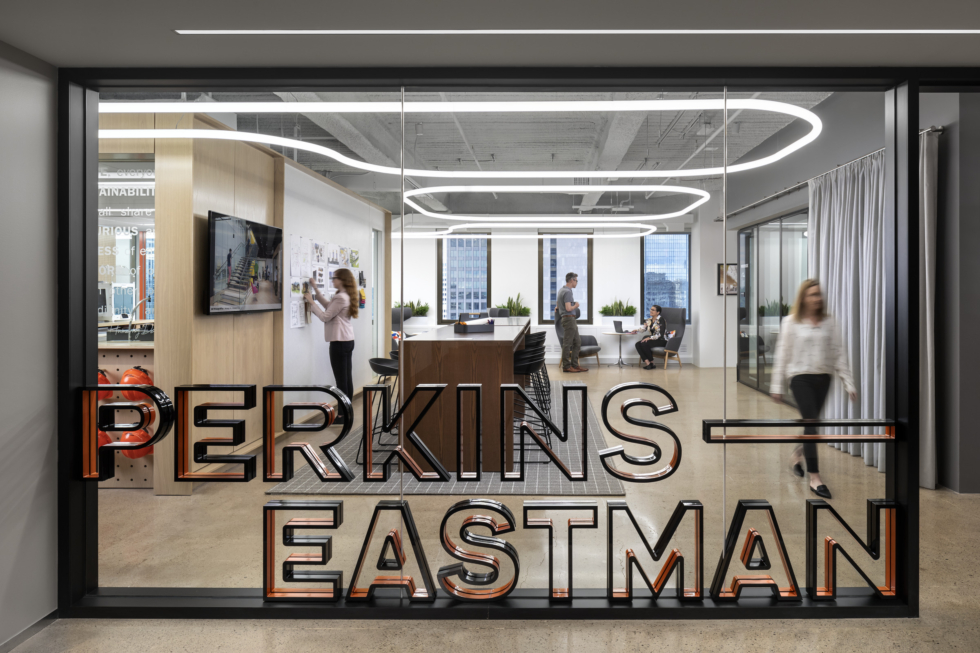 The entrance to Perkins Eastman's Pittsburgh studio features bold and playful signage and bright, welcoming space.