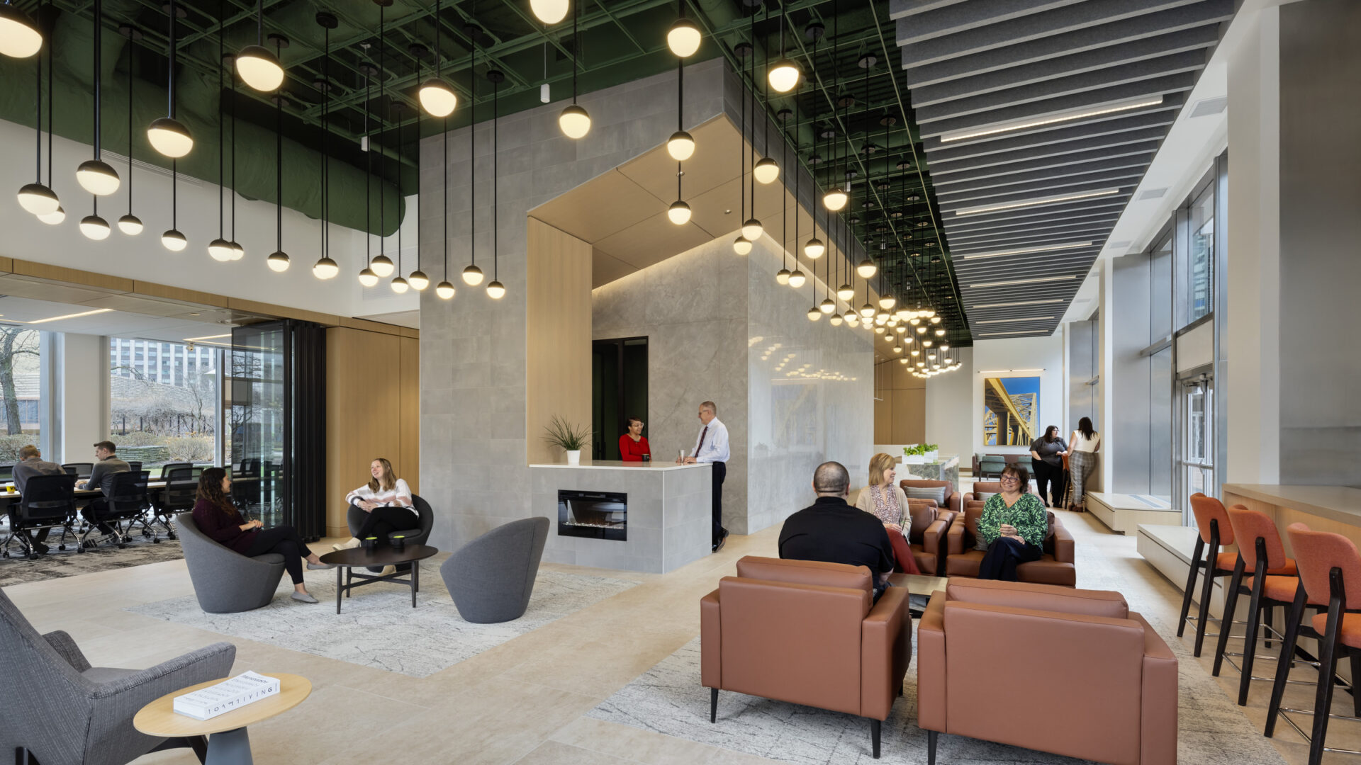 The conference center for Dickie, McCamey & Chilcote is lined on three sides with walls of windows looking out toward downtown Pittsburgh and Gateway Center Park.