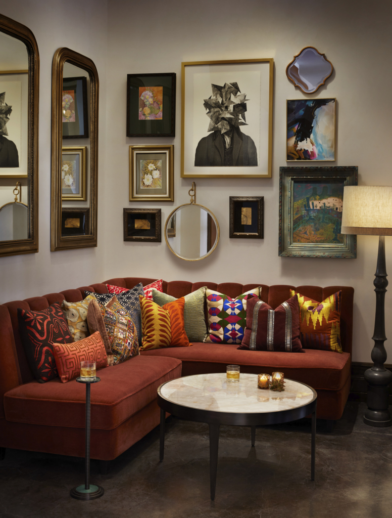 A colorful banquette activates a corner of the lounge in the Plaza Hotel Pioneer Park’s refurbished lobby. 